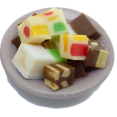 Image of Cubes of Turron on Purple Plate 